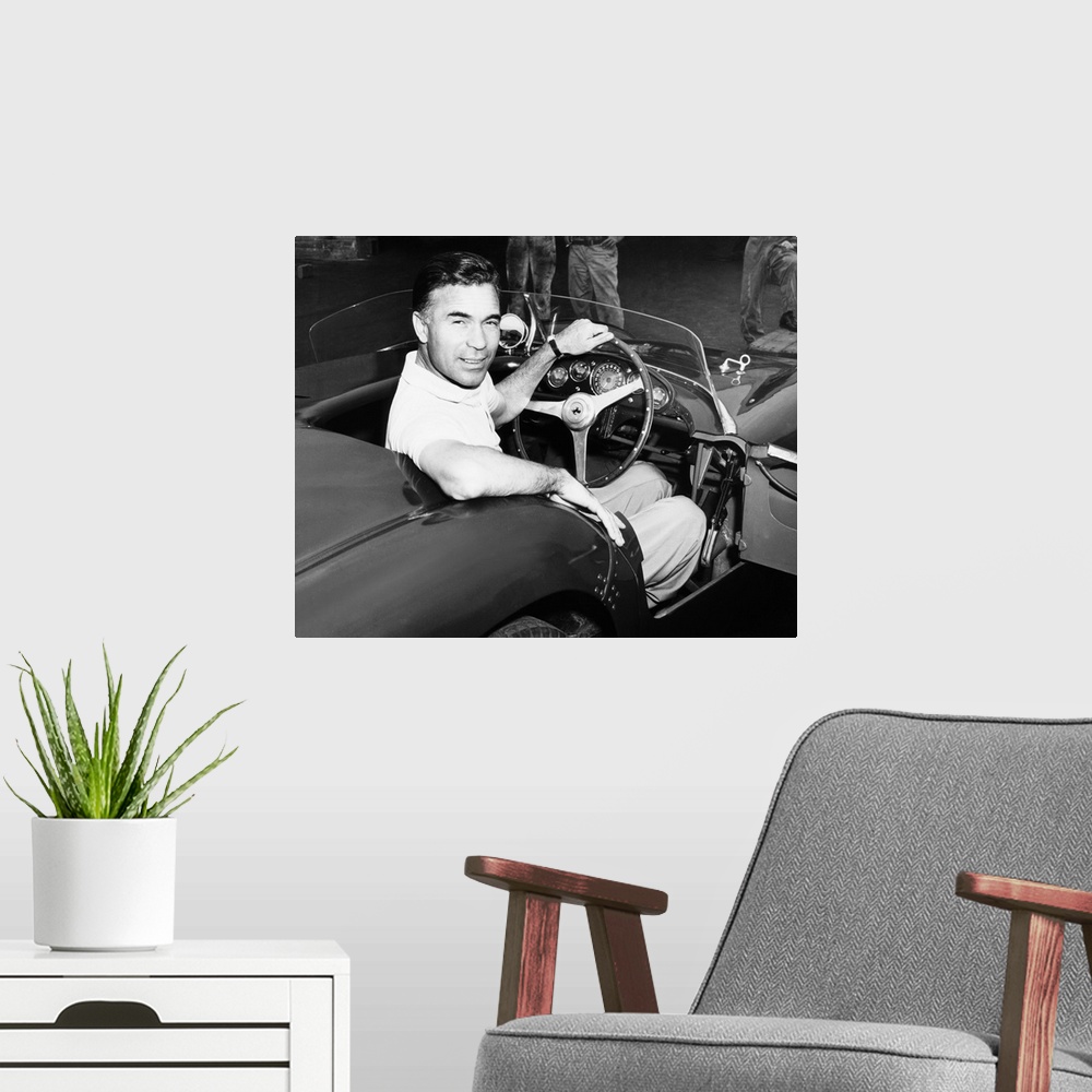 A modern room featuring Porfirio Rubirosa at the wheel of his Italian race car, a $17,000 Ferrari Mondial. Cleveland Pres...