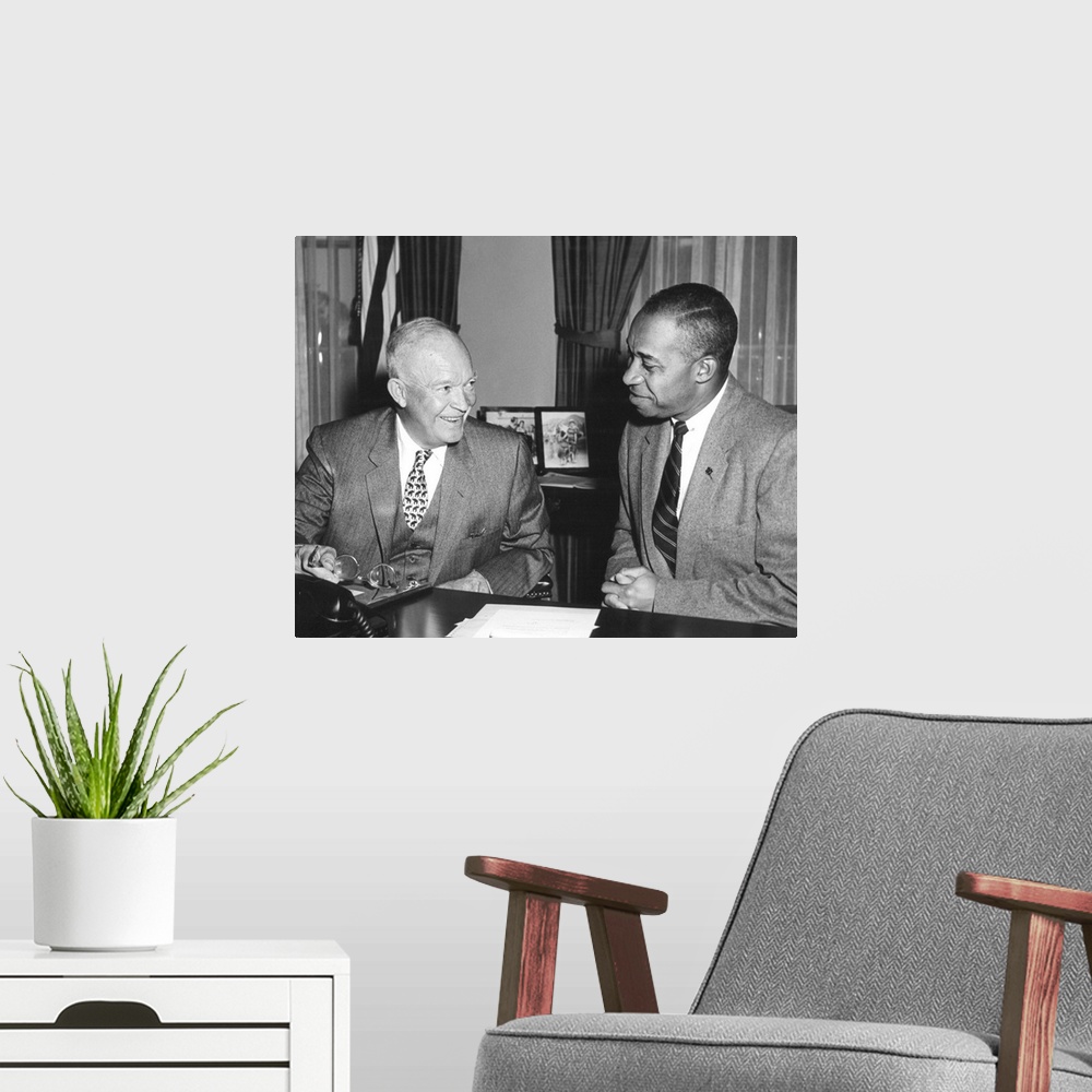 A modern room featuring President Eisenhower with Fred Morrow, Oct. 4, 1956. Morrow served as a personal adviser and admi...