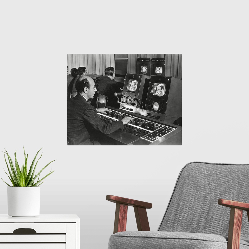 A modern room featuring Television studio engineer gets several views of the image and use the complicated set of dials t...