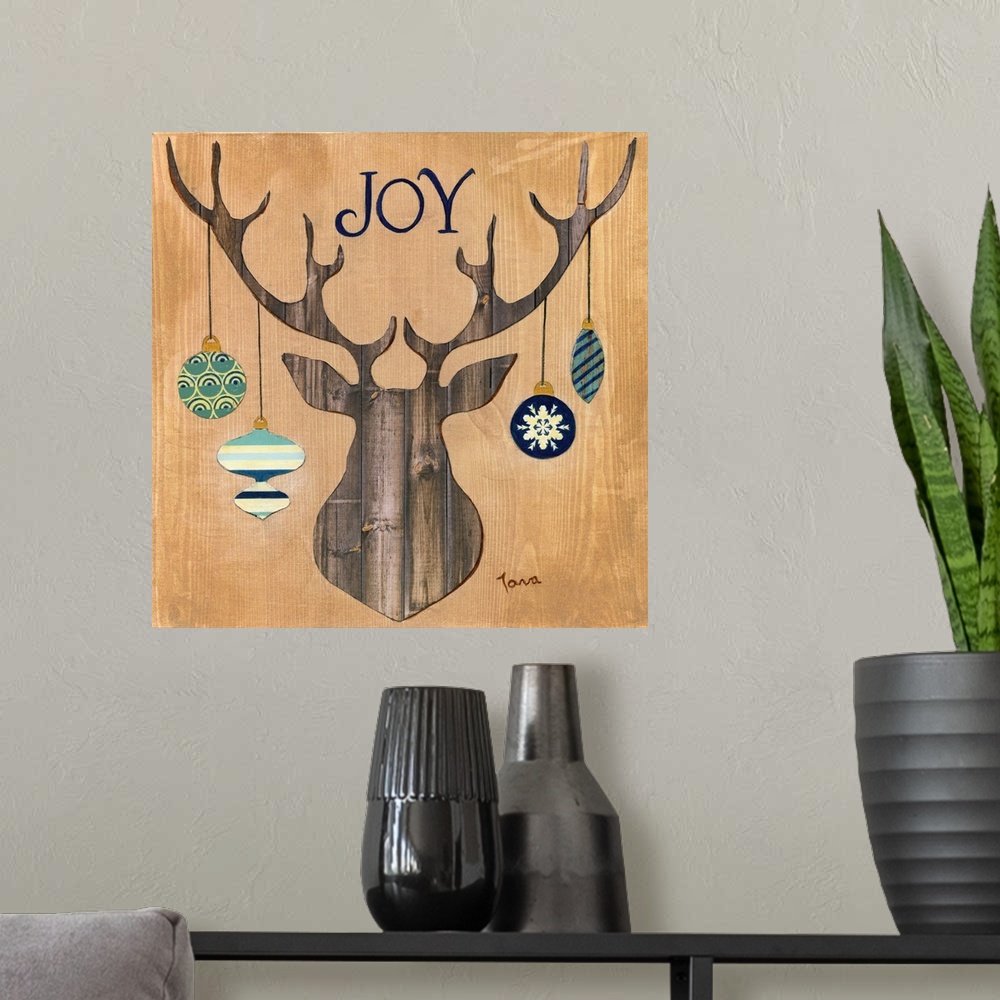 A modern room featuring A decorative seasonal piece with a wooden mounted deer that has ornaments hanging from the antlers.
