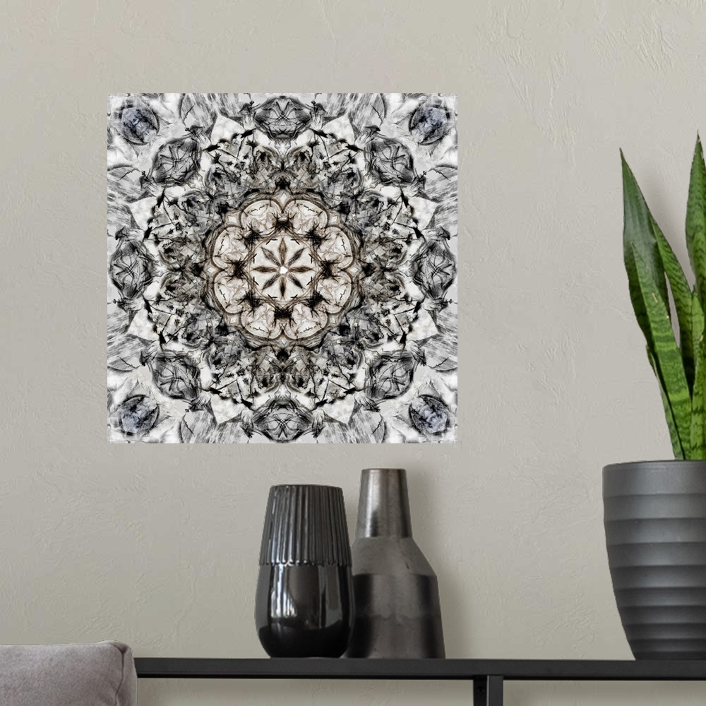 A modern room featuring Square abstract art in black and white hues with kaleidoscope-like patterns and designs.