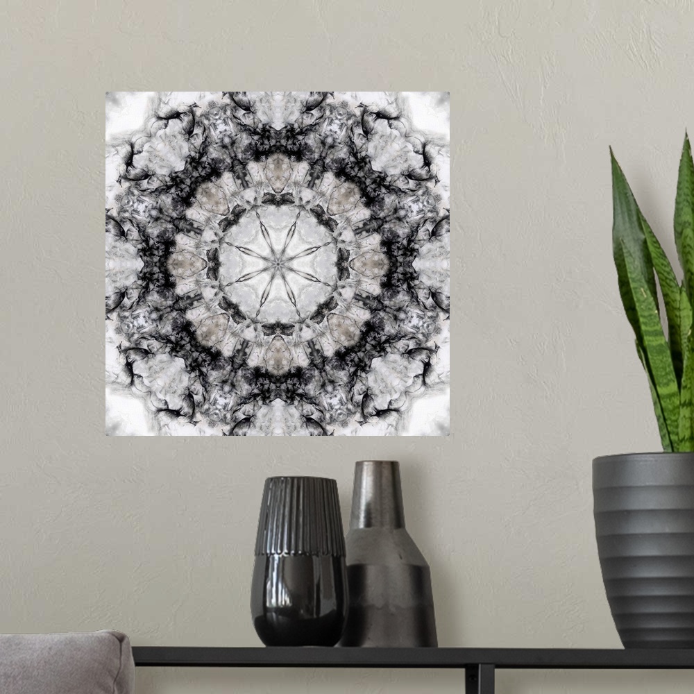 A modern room featuring Square abstract art in black and white hues with kaleidoscope-like patterns and designs.