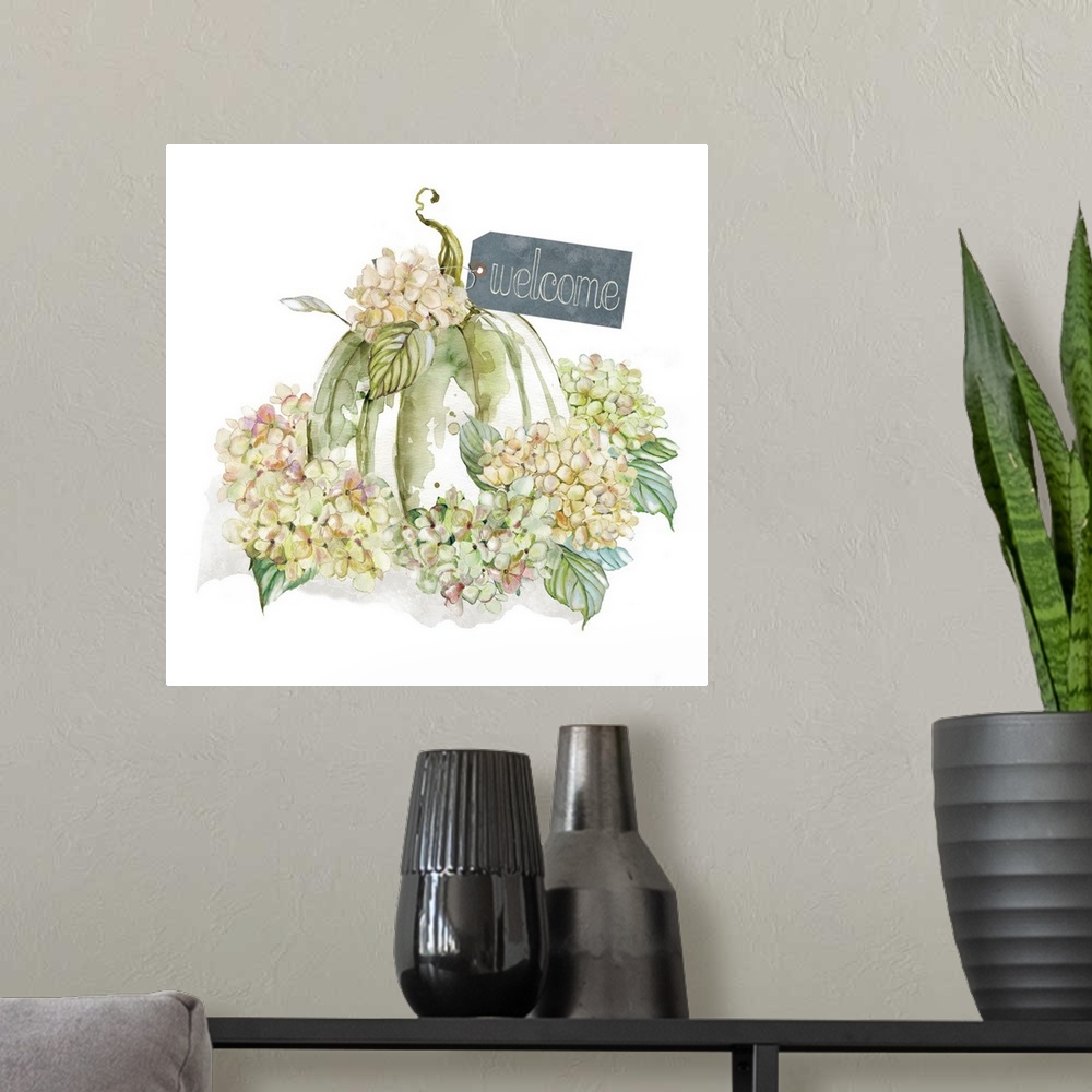 A modern room featuring Square harvest decor with watercolor hydrangeas and a pumpkin with a tag on it that reads "Welcome"