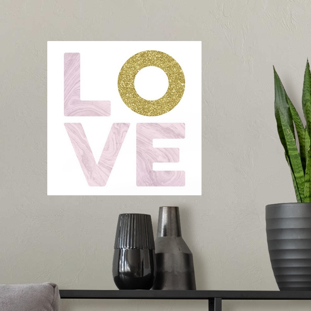 A modern room featuring LOVE spelled out in white marble and glitter gold on a white square background with a glitter gol...