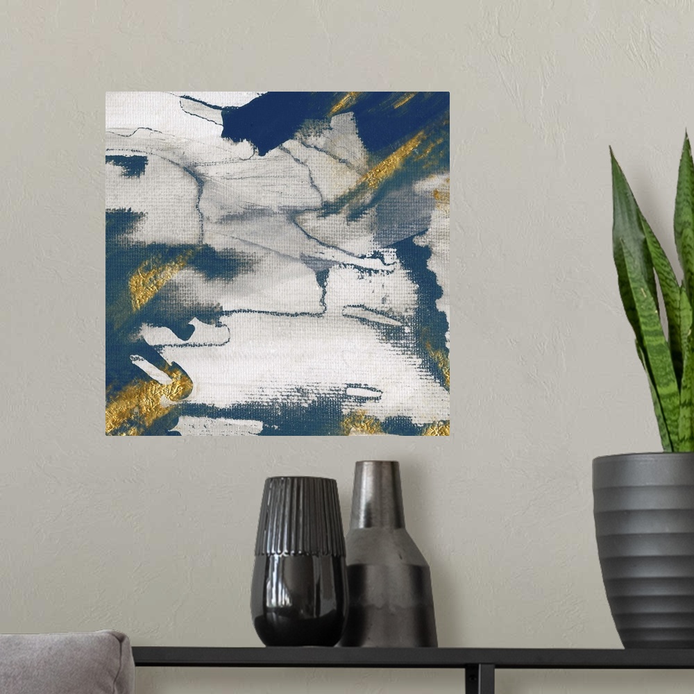 A modern room featuring Modern abstract artwork with shades of deep blue accented with gold.