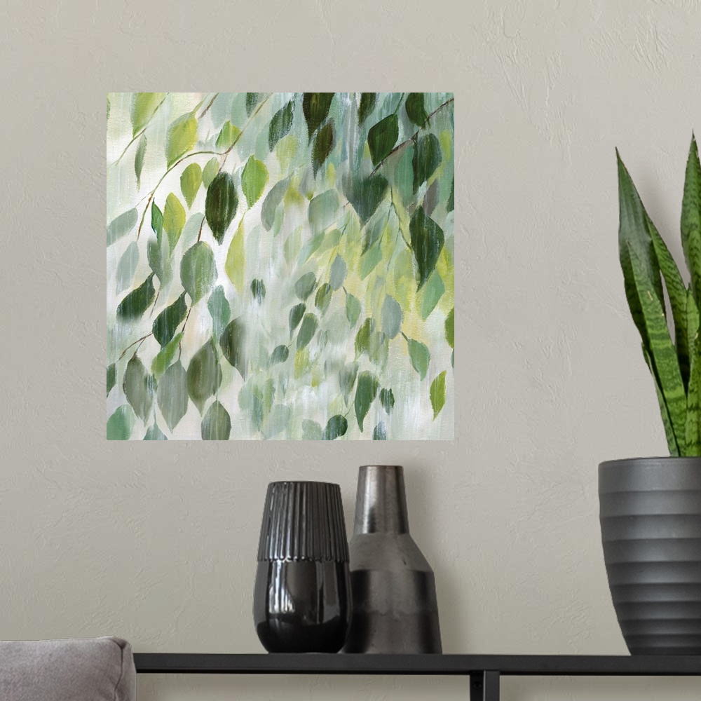 A modern room featuring Square painting of leaves in shades of green with a white misty overlay on a white background.