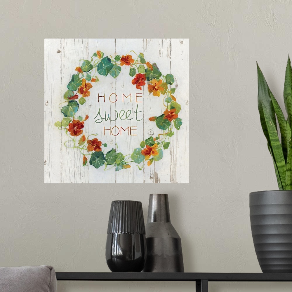 A modern room featuring "Home, sweet home" quote is framed with a wreath of Nasturtium flowers.