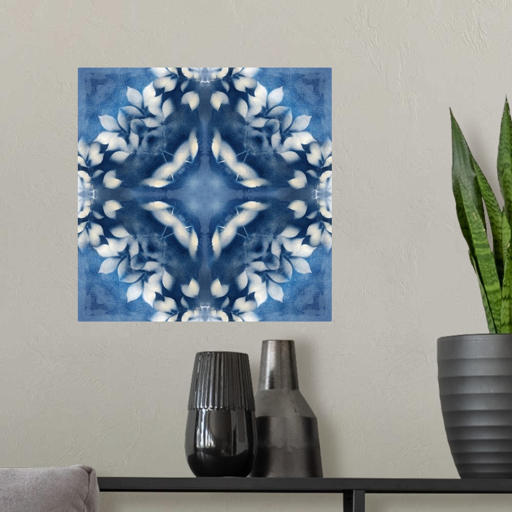 A modern room featuring Square abstract art in navy blue and white hues with kaleidoscope-like patterns and designs.