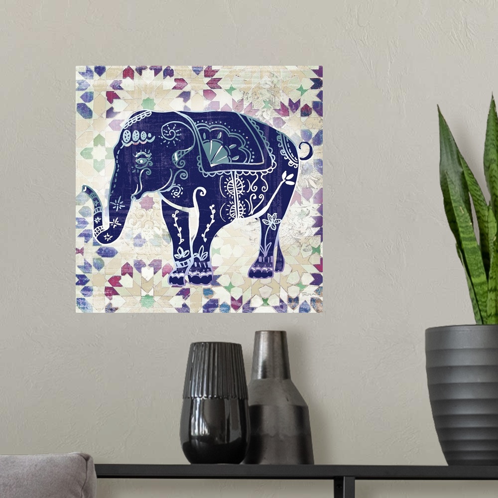 A modern room featuring Square decor with an indigo elephant that has beautiful designs on top of a patterned background.