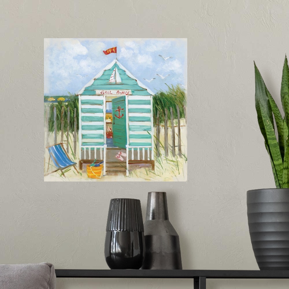 A modern room featuring Square painting of a teal and white beach hut with the ocean in the distance.