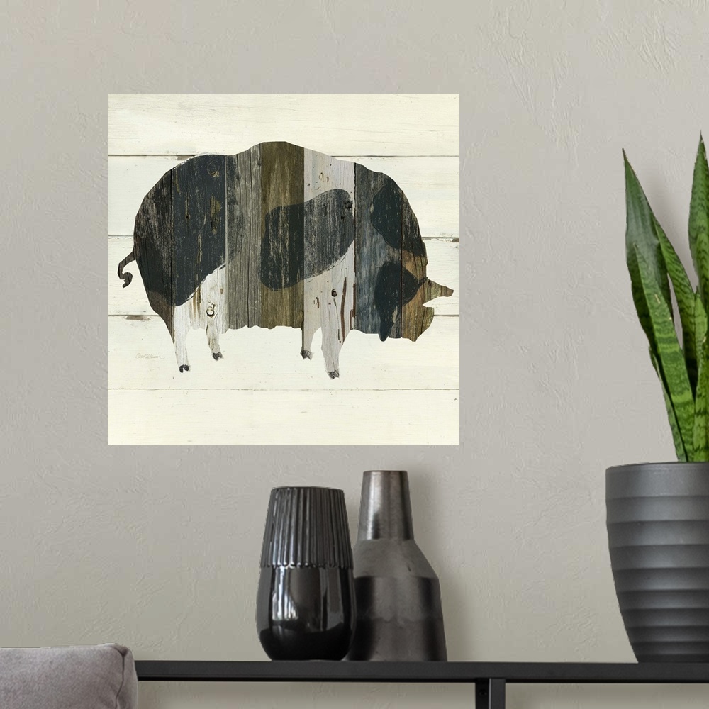 A modern room featuring A painting of a pig using multicolored stained wood placed on a white wooden background.