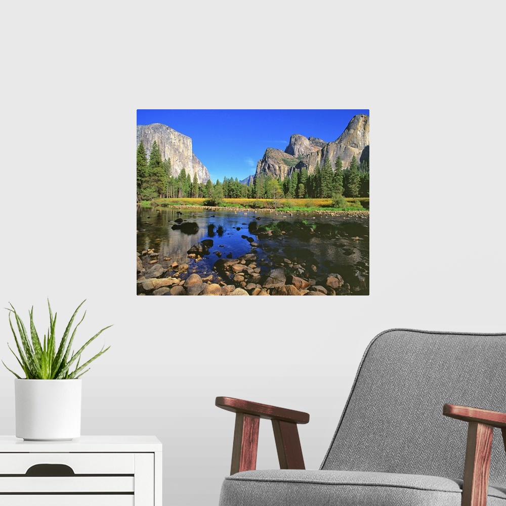 A modern room featuring A river running through Yosemite Valley, near Half Dome.