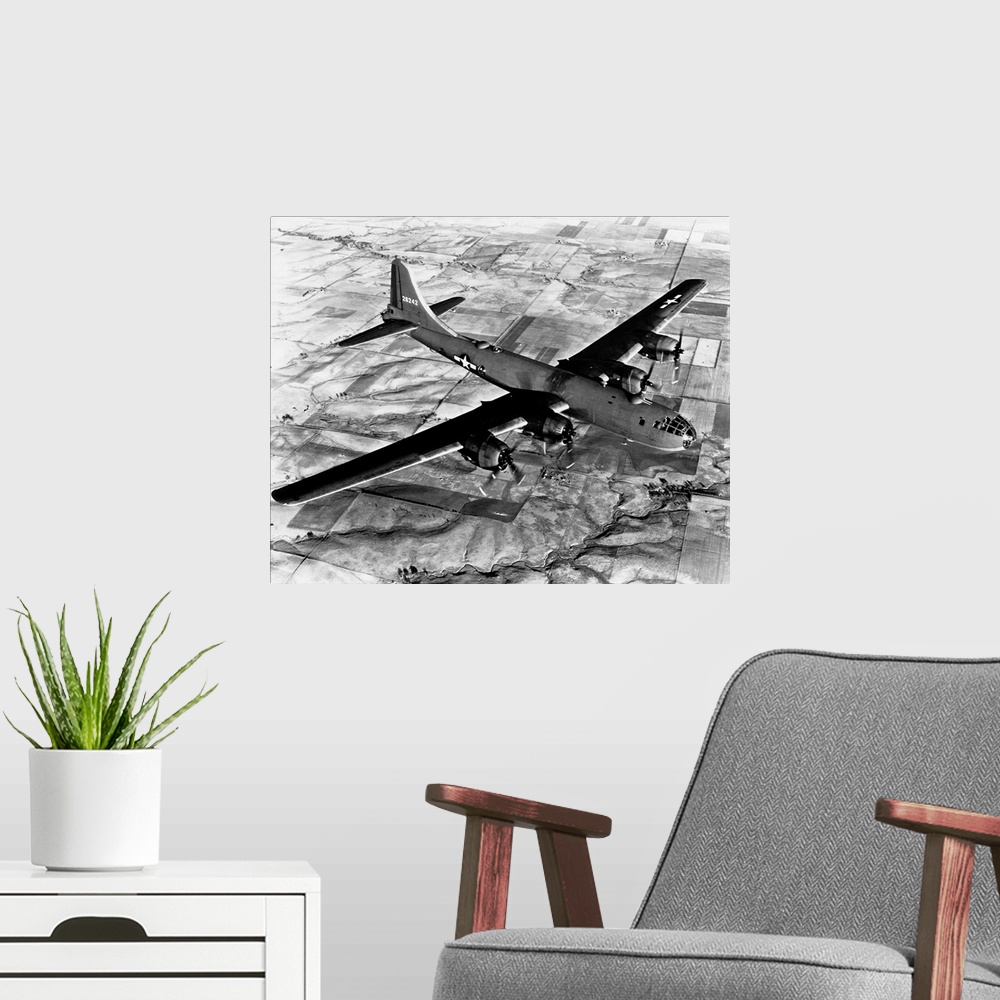 A modern room featuring Aerial view of a B-29 flying over Japanese fields.