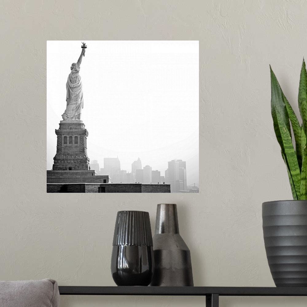 A modern room featuring Black and white image of statue of Liberty with island of Manhattan/New York City in background.