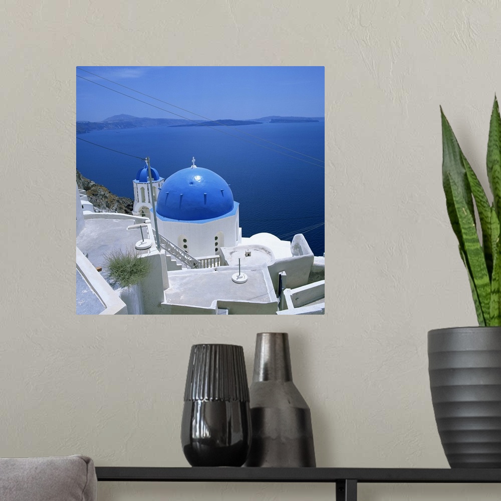 A modern room featuring Blue church dome in Imerovigli, Santorini