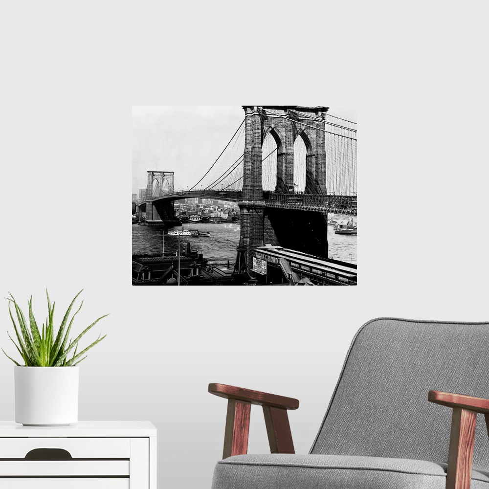A modern room featuring A view of the Brooklyn Bridge, an engineering feat. When the bridge was completed in 1883, it was...