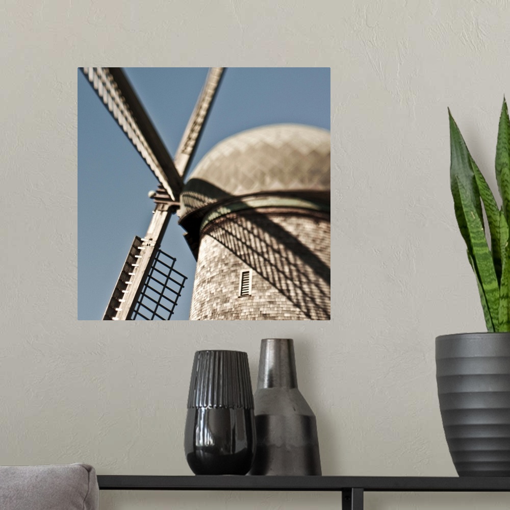 A modern room featuring close up of a Dutch windmill.