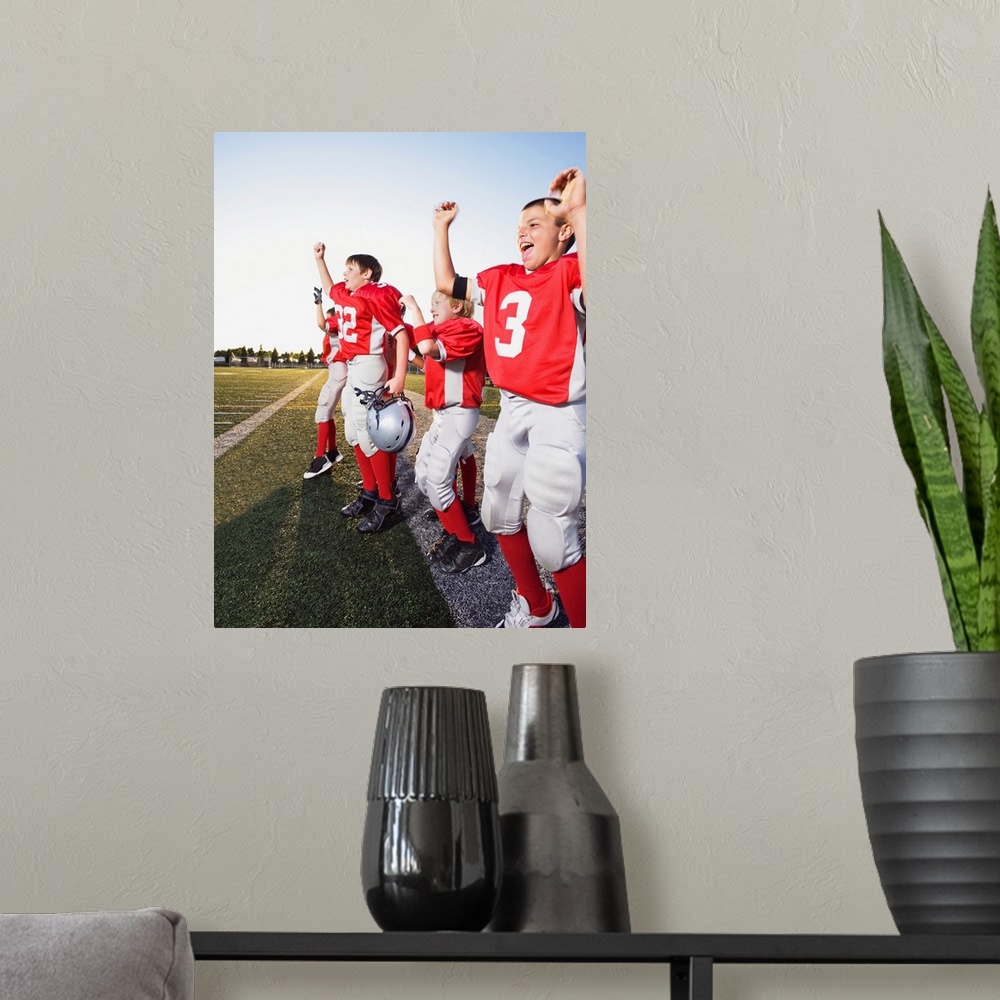 A modern room featuring Football players cheering on sideline