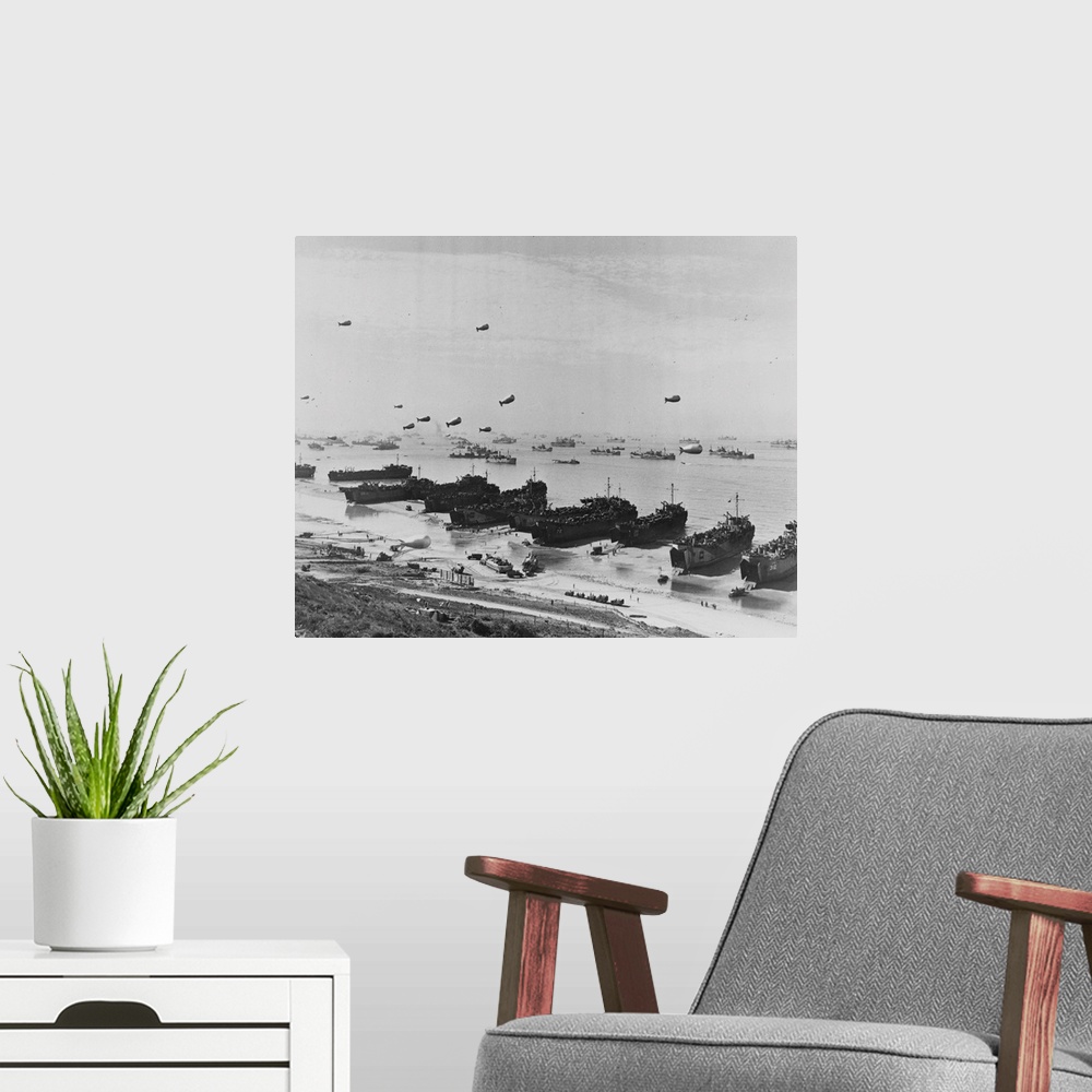 A modern room featuring A panoramic view of Omaha beach during the Normandy Landings. Barrage balloons hover over assembl...