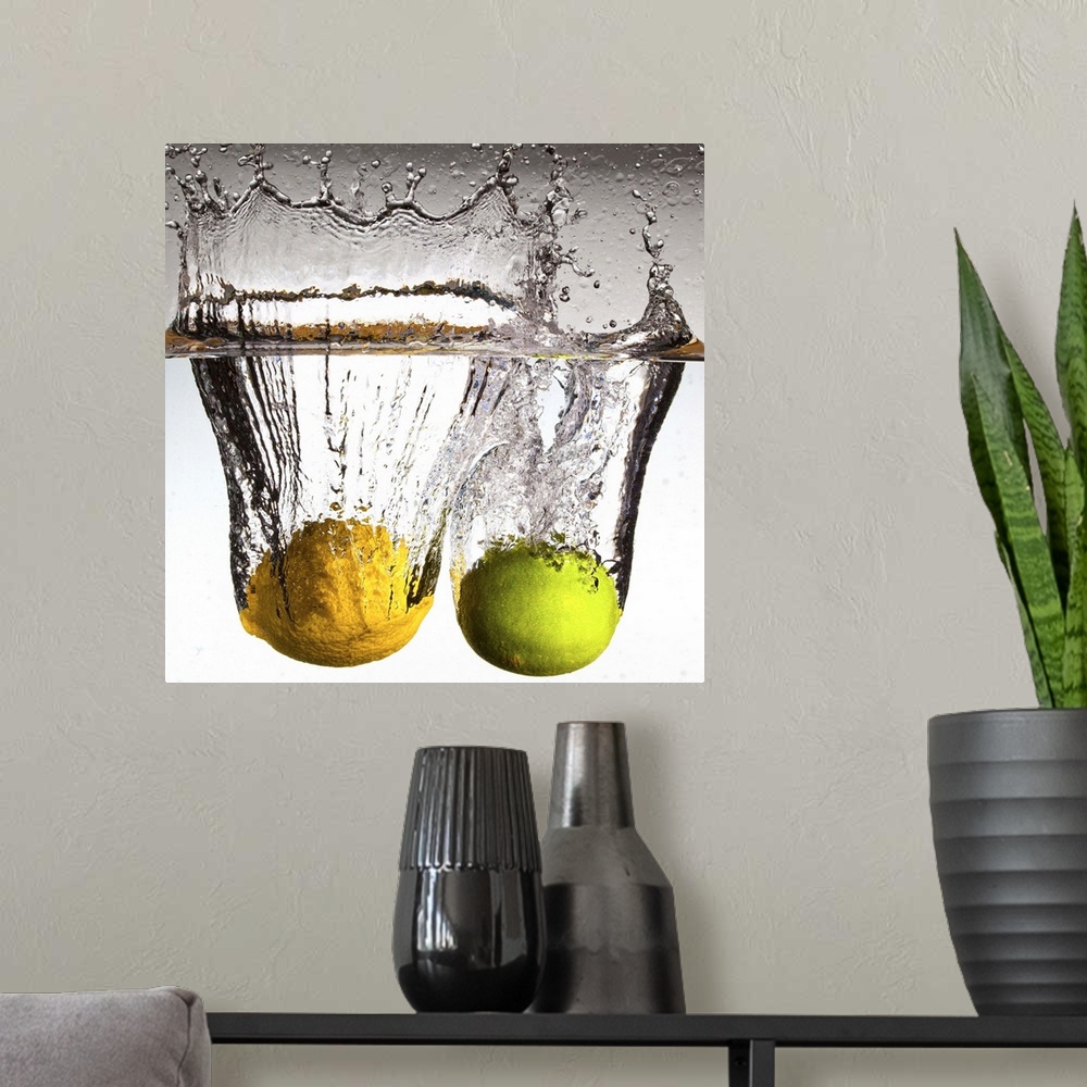 A modern room featuring Square canvas photo of a lime and lemon moving through water with water splashing up at the top.