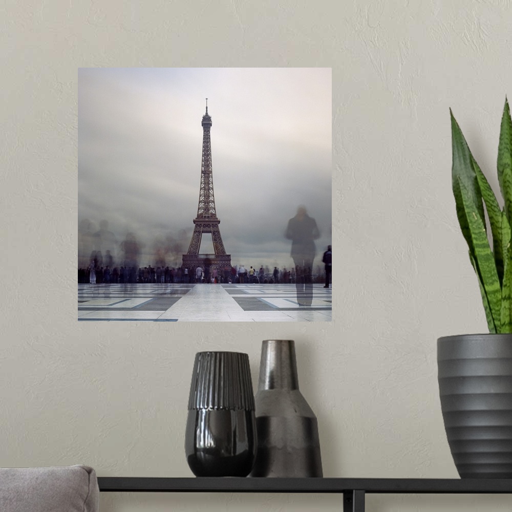 A modern room featuring Long exposure of Eiffel Tower with figures in crowds blur in Paris.