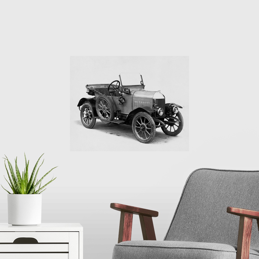 A modern room featuring A member of early automobile history: the first Morris Oxford two-seater convertible built in 1913.