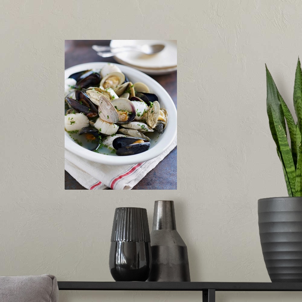 A modern room featuring Mussels, scallops, clams in broth
