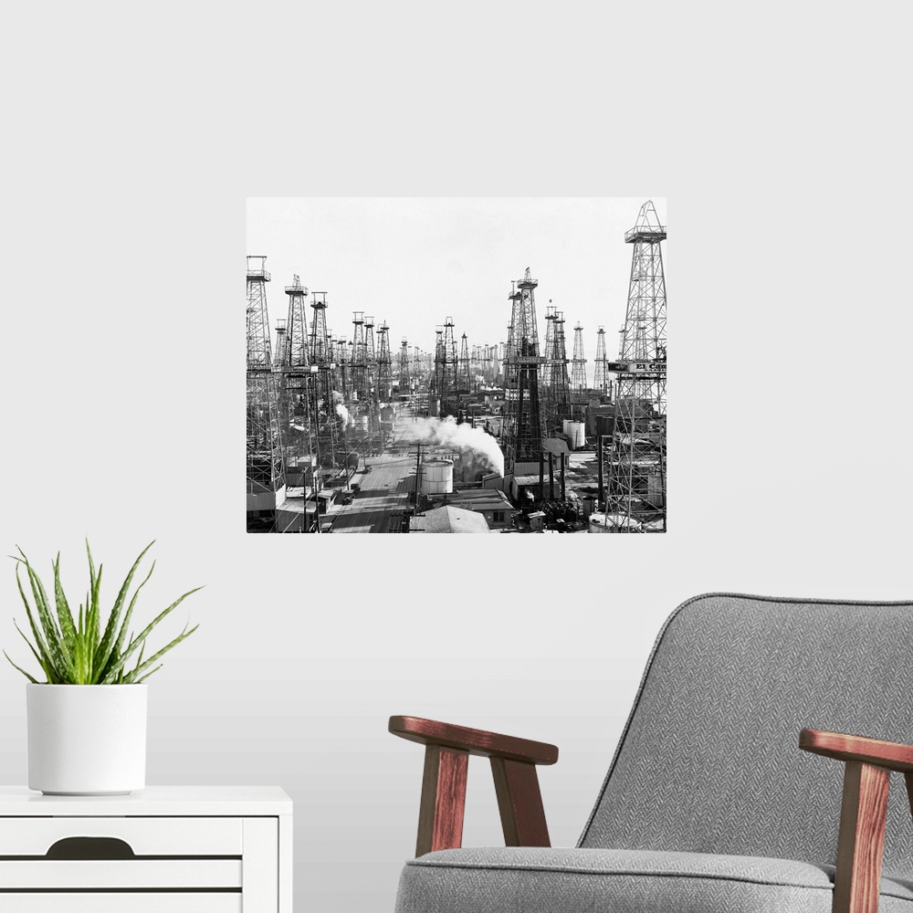 A modern room featuring An abundance of derricks in an oil field near Los Angeles, California, USA. | Location: Near Los ...