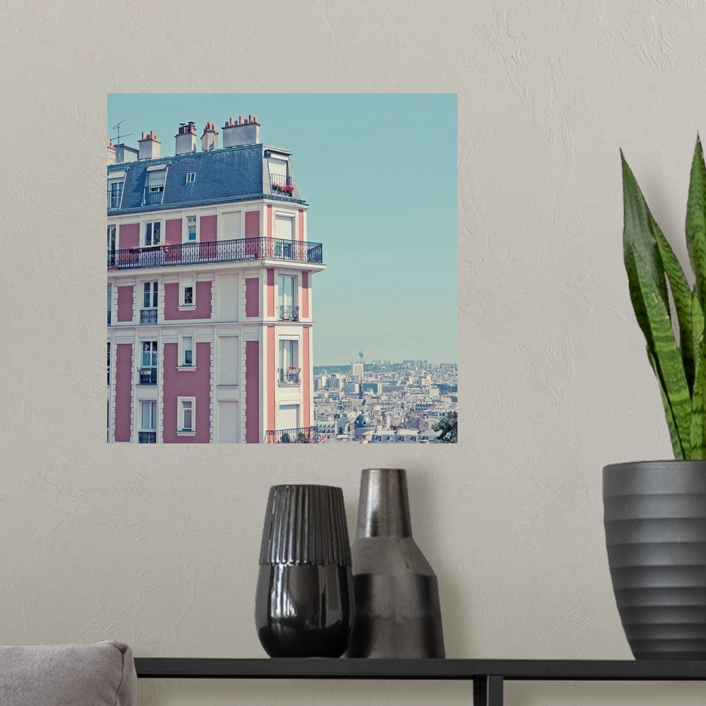 A modern room featuring Orange apartment building with view over Paris, Montmartre, Paris, France.