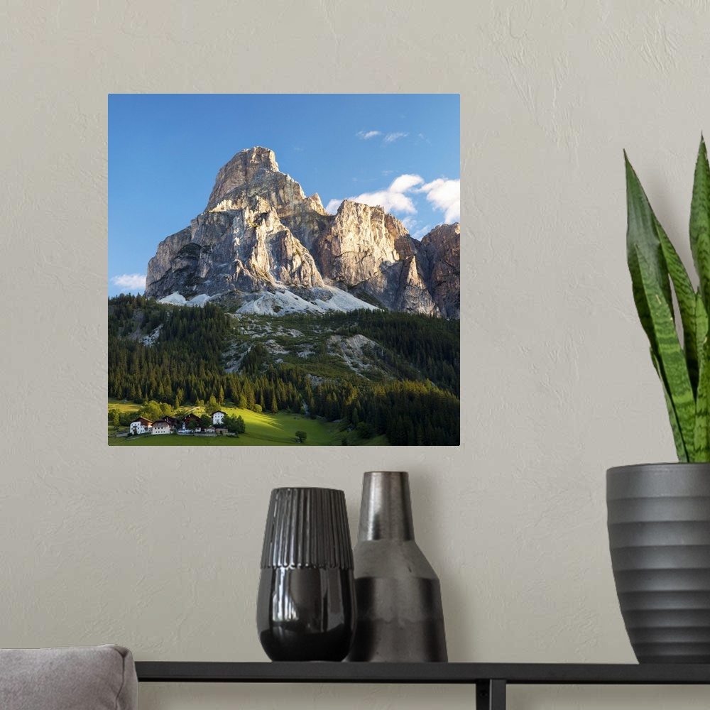 A modern room featuring Peak in Dolomites called Sassongher at sunrise in Corvara in Badia.
