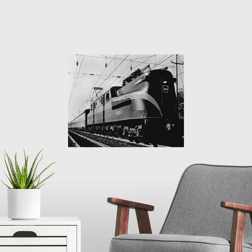 A modern room featuring The Broadway Limited, an all sleeping car GG-1 type electric train on the Pennsylvania Railroad m...