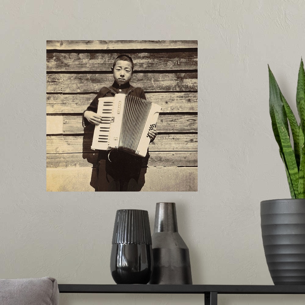A modern room featuring Portrait of a Japanese student playing Accordion