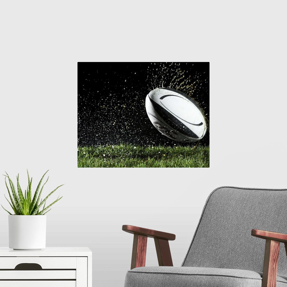 A modern room featuring Rugby ball in motion over grass