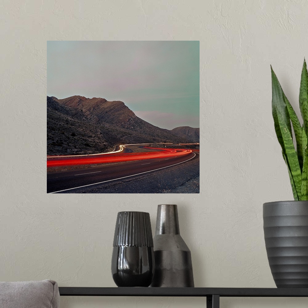 A modern room featuring Time Lapse Long Exposure Rush Hour through Mountain Road. Southwestern USAWest TexasUSA