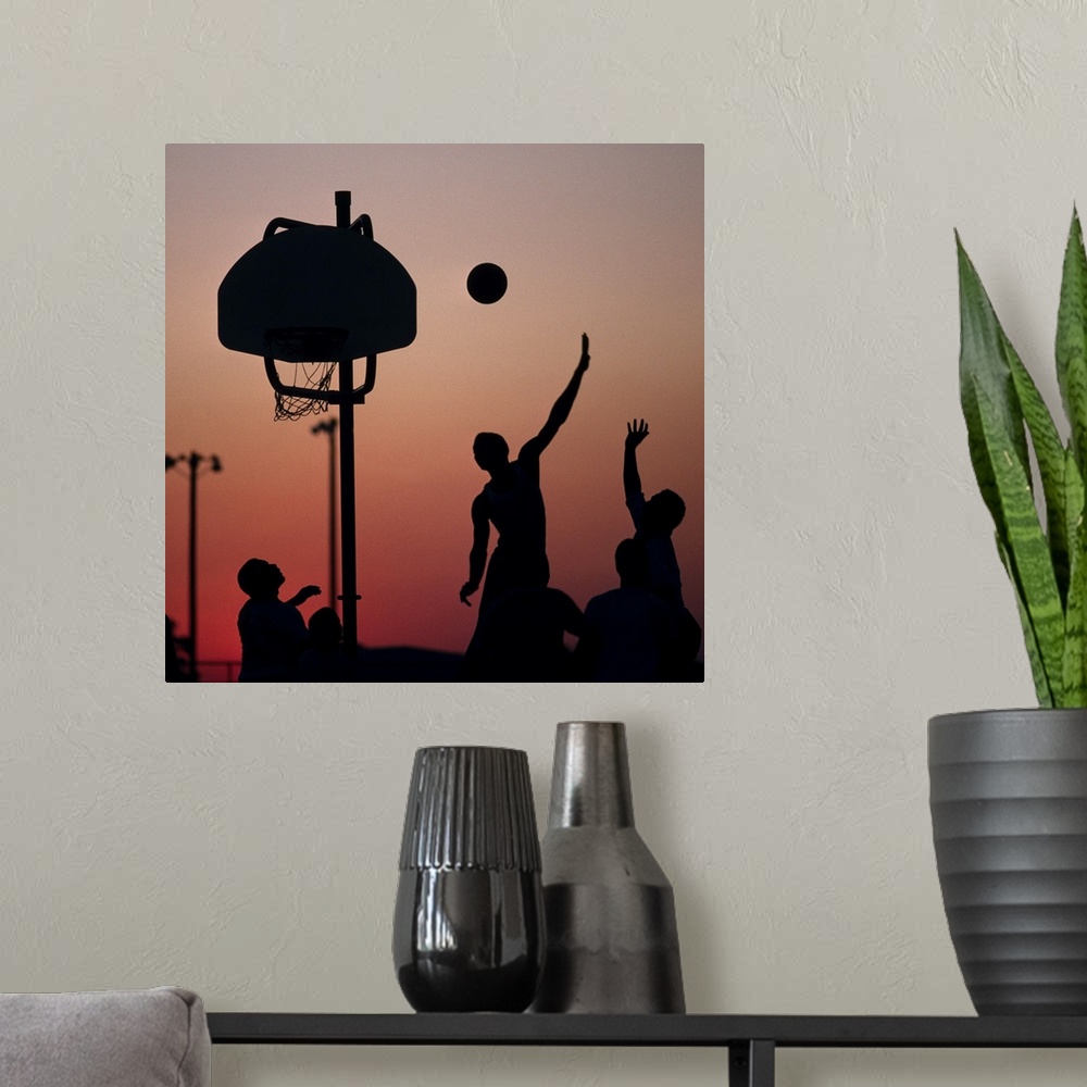 A modern room featuring Silhouette of men playing basketball