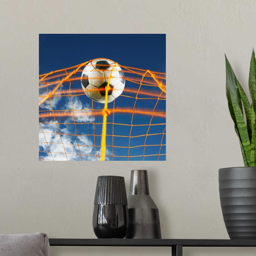 A modern room featuring Soccer Ball Going Into Goal Net