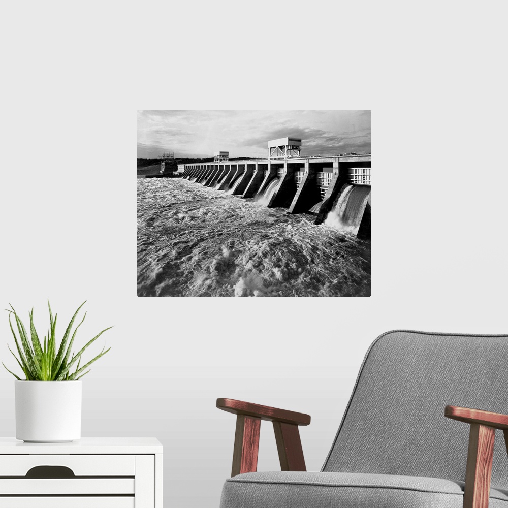 A modern room featuring Water pours from open spillways at the Pickwick Landing Dam, a project of the Tennessee Valley Au...