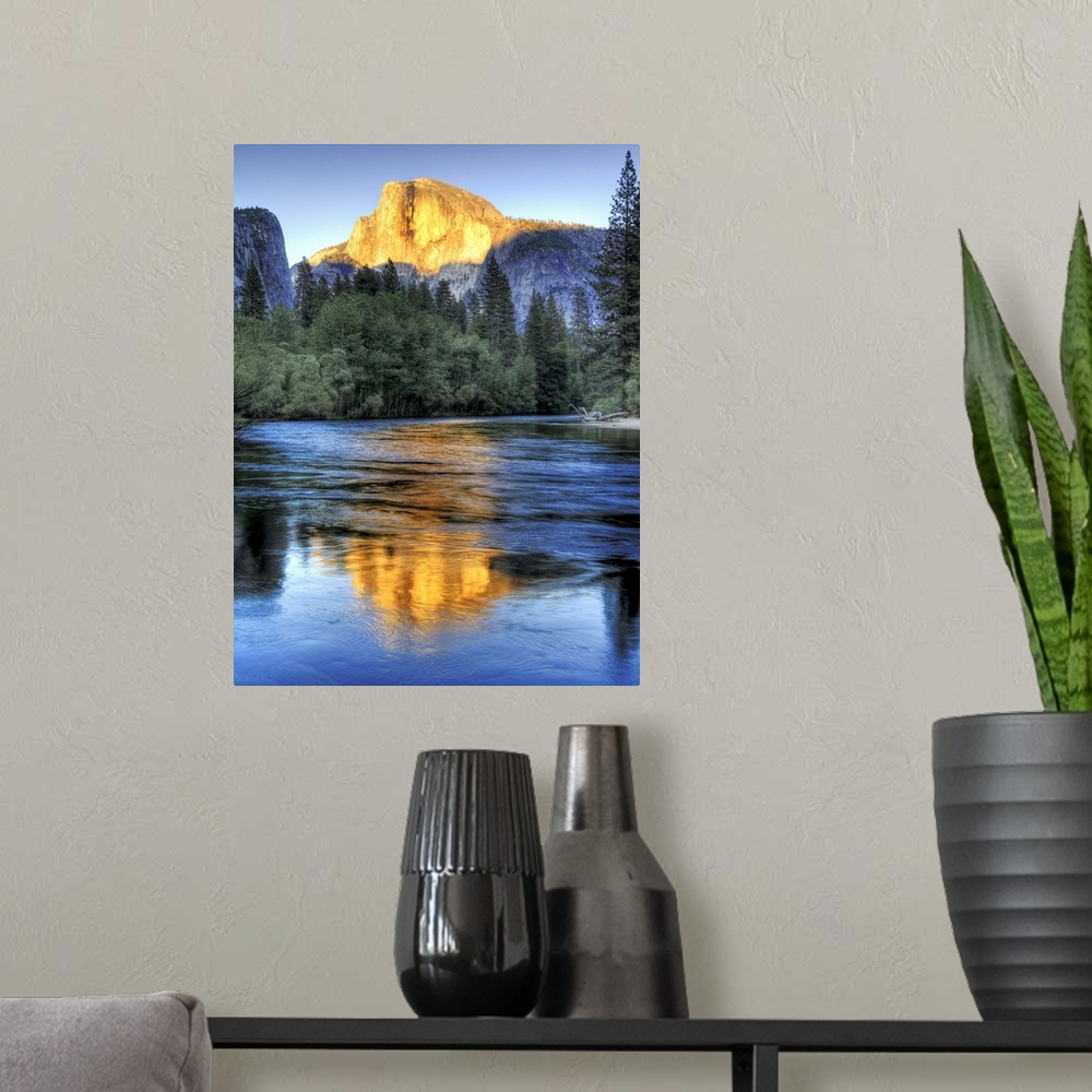 A modern room featuring Golden light of sunset on half Dome reflecting in Merced river in Yosemite National Park.
