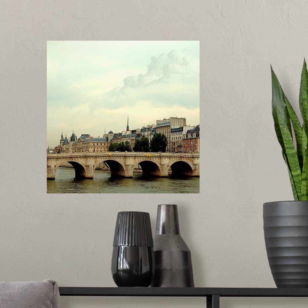 A modern room featuring The many bridges crossing the Seine River in Paris France.