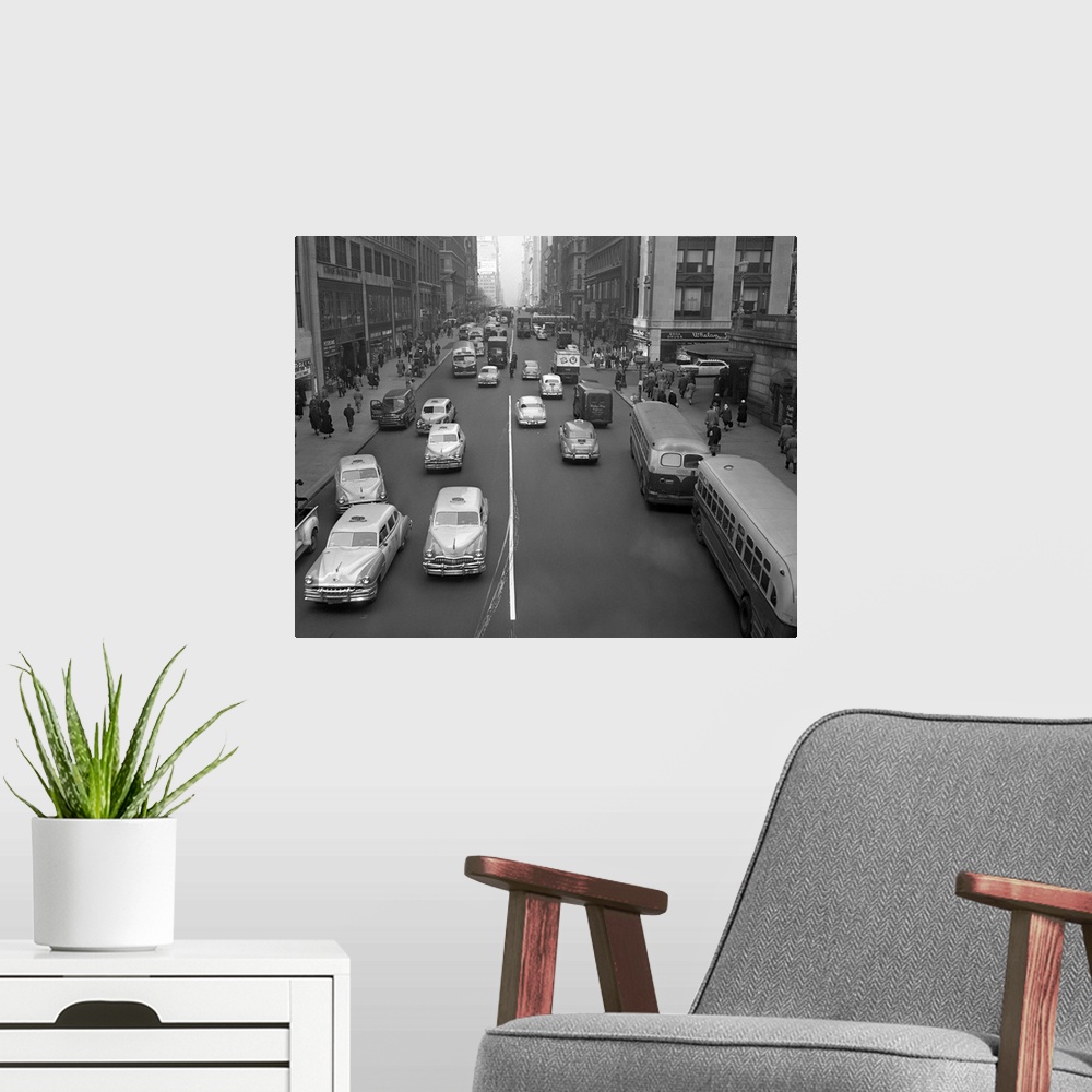 A modern room featuring Photo shows 42nd St. looking west showing traffic and people at about 9am.