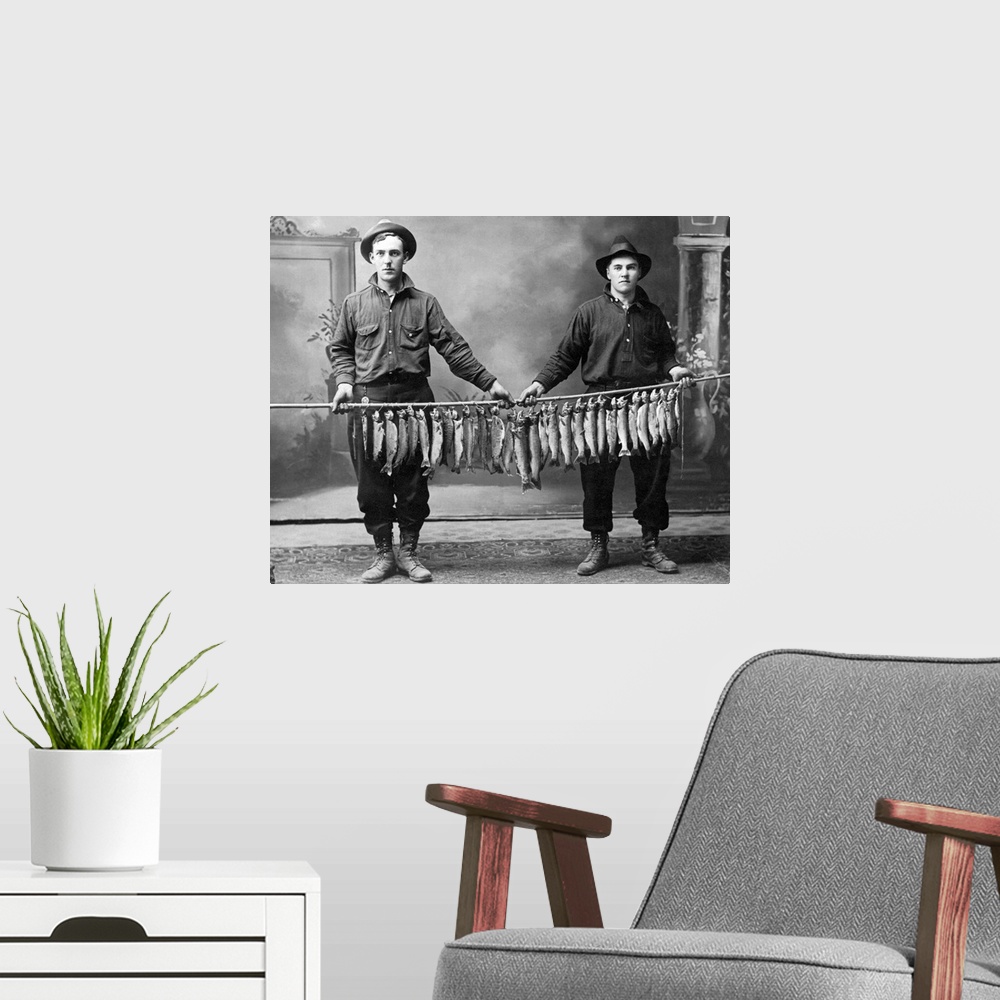 A modern room featuring Vintage image of men holding string of fish