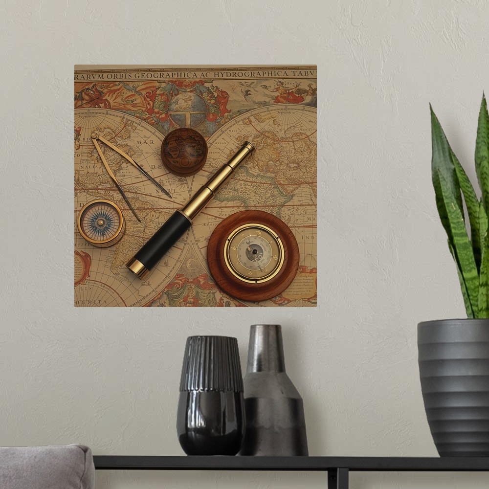 A modern room featuring Square, oversized photograph of an antique world map with vintage navigation tools such as a comp...