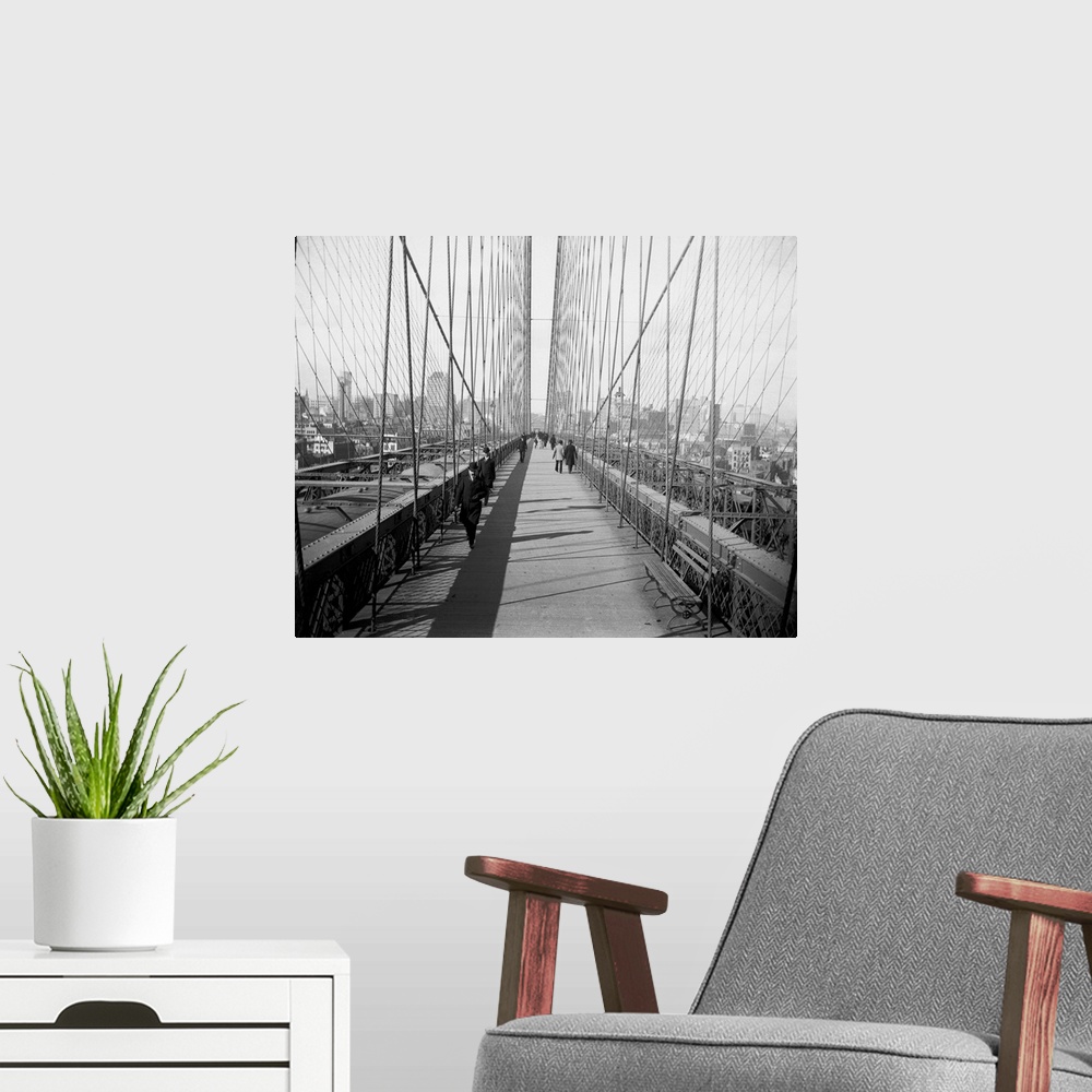 A modern room featuring Brooklyn Bridge walkway towards Manhattan.