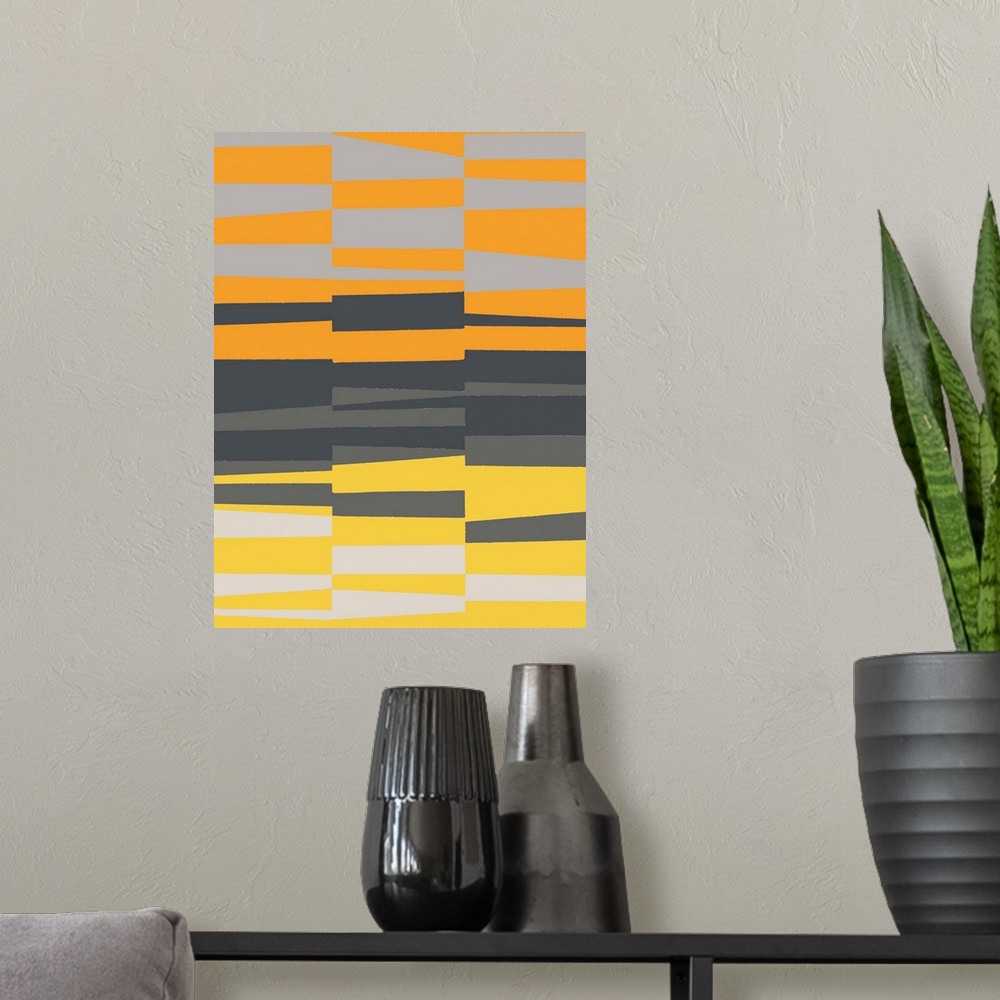 A modern room featuring Geometric abstract artwork in shades of yellow, orange, and grey.