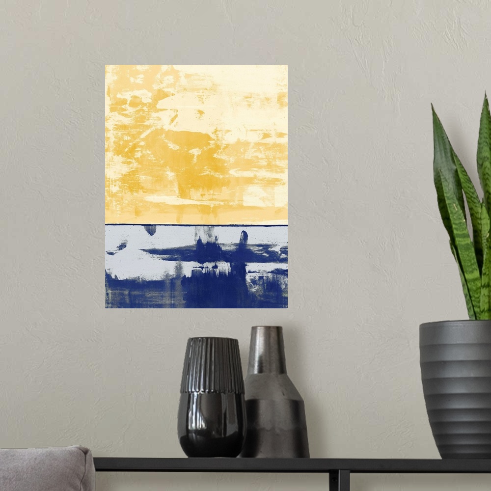 A modern room featuring Large abstract painting with pale yellow and gold hues at the top and a royal blue section at the...