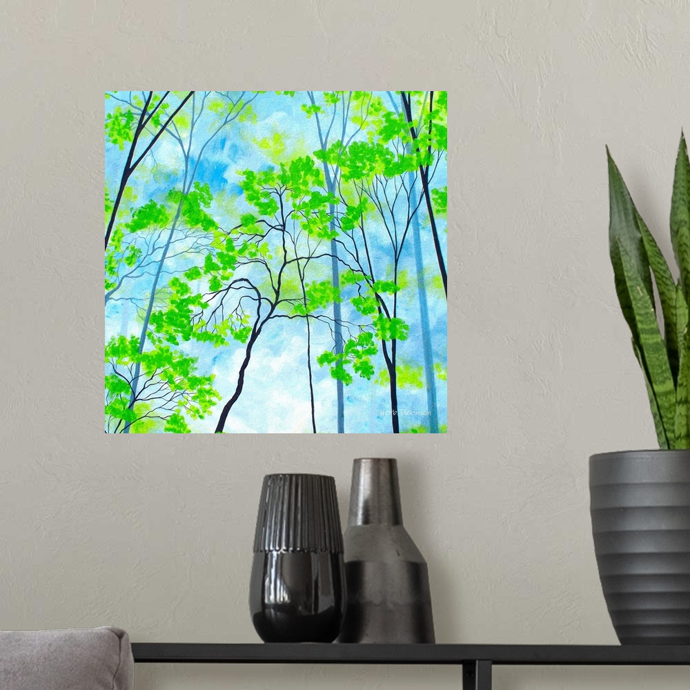 A modern room featuring Square painting with bright green tree tops on a cloudy blue background.