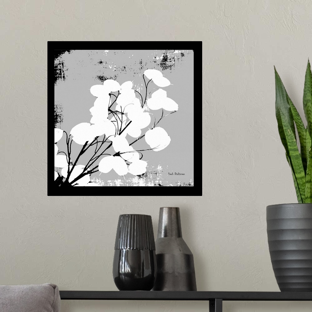 A modern room featuring Square silhouetted painting of a money plant in black, white, and gray.