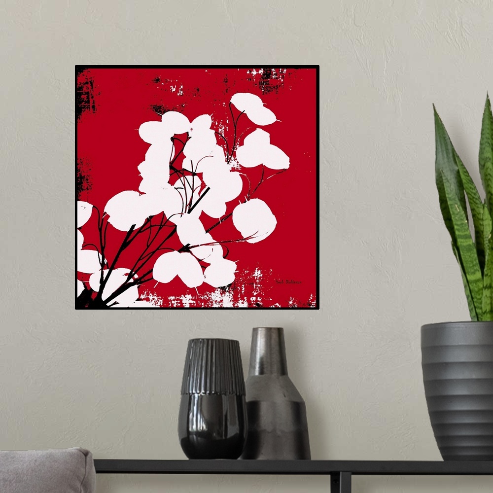 A modern room featuring Square silhouetted painting of a money plant in red, black, and white with a black boarder.