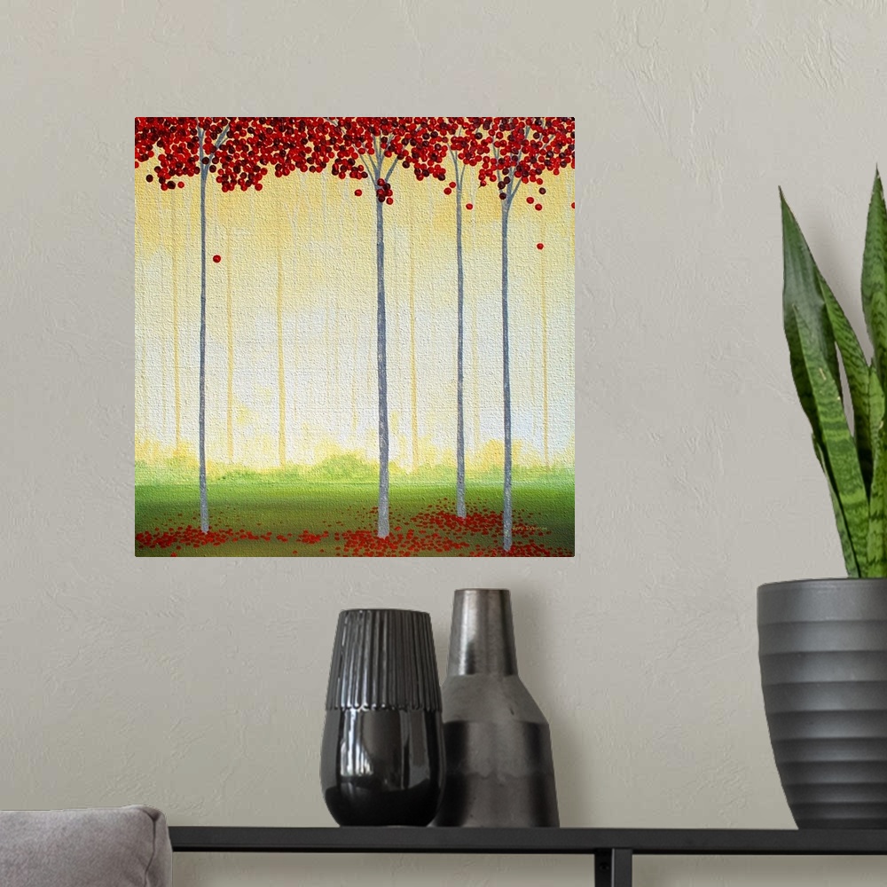 A modern room featuring Square painting of tall, thin trees with circular red leaves in a golden lit forest.