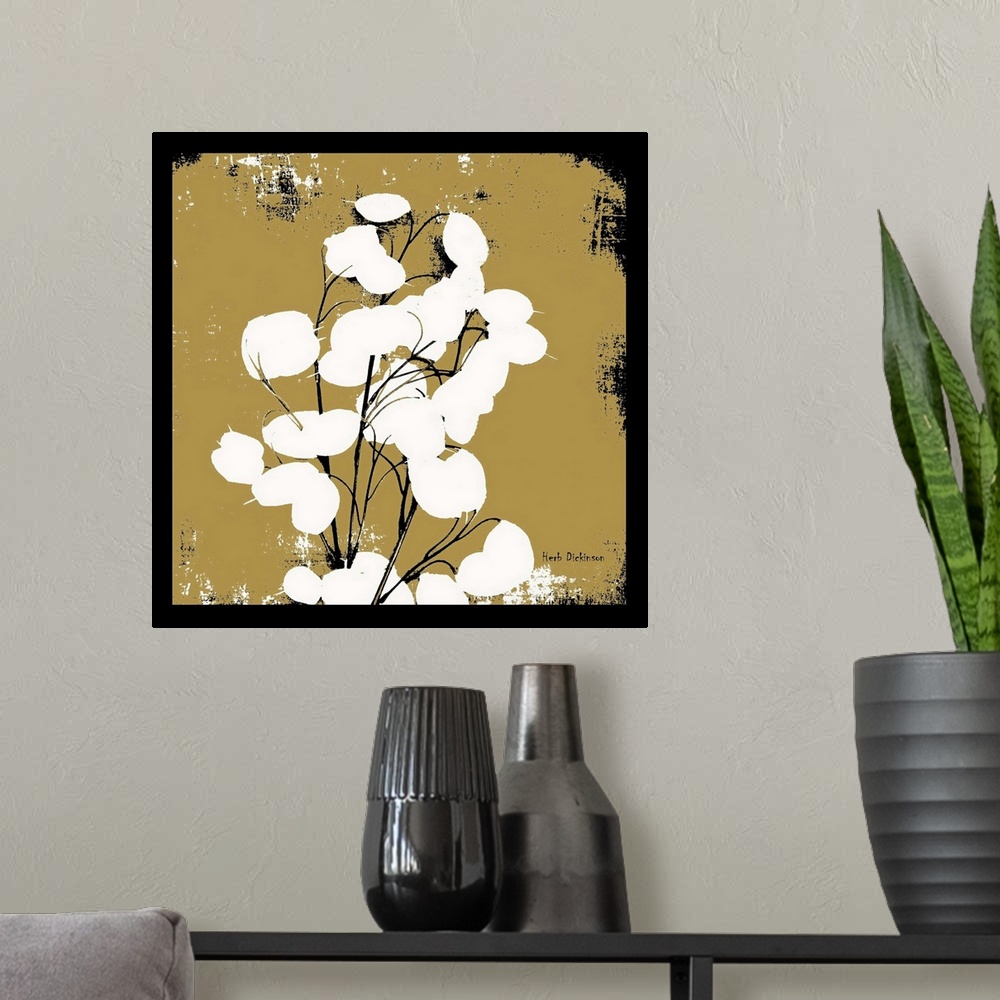 A modern room featuring Square silhouetted painting of a money plant in black, gold, and white with a black boarder.